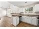 The modern kitchen features stainless steel appliances, granite counters, and new cabinets at 486 Windcroft Nw Cir, Acworth, GA 30101