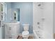 Beautifully renovated bathroom with modern fixtures, white tile, and a bathtub-shower combo at 5233 Groovers Landing Se Rd, Acworth, GA 30101