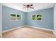 Bright, airy bedroom featuring hardwood floors and large windows with outdoor views at 5233 Groovers Landing Se Rd, Acworth, GA 30101