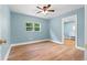 Bedroom featuring hardwood floors, natural light and an ensuite bathroom at 5233 Groovers Landing Se Rd, Acworth, GA 30101
