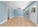 Bright living room with beautiful wood floors, a ceiling fan, and natural light at 5233 Groovers Landing Se Rd, Acworth, GA 30101