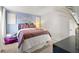 Stylish bedroom featuring a blue accent wall, cozy bed, and chic decor for a relaxing retreat at 105 Crooked Lake Park, Villa Rica, GA 30180