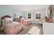 Charming bedroom with two twin beds and a large window, creating a bright and inviting space at 105 Crooked Lake Park, Villa Rica, GA 30180