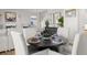 Stylish dining area featuring a round table, comfortable seating and modern decor at 105 Crooked Lake Park, Villa Rica, GA 30180
