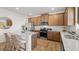 Modern kitchen showcasing wooden cabinetry, stainless steel appliances, and an island with seating at 105 Crooked Lake Park, Villa Rica, GA 30180