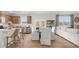 Open-concept floor plan with a kitchen island flowing into a dining area and living space at 105 Crooked Lake Park, Villa Rica, GA 30180