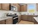 Beautiful kitchen with stainless steel appliances, white subway tile backsplash, and ample counter space at 105 Crooked Lake Park, Villa Rica, GA 30180