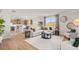 Inviting living room connected to a kitchen and dining area, with ample natural light at 105 Crooked Lake Park, Villa Rica, GA 30180