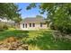 A charming home with a large backyard featuring a green lawn and an inviting patio for outdoor enjoyment at 110 Holly Mill Village Dr, Canton, GA 30114
