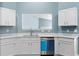 Modern kitchen featuring white cabinetry, granite countertops, and stainless steel appliances at 110 Holly Mill Village Dr, Canton, GA 30114