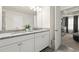 Bright bathroom featuring double vanity with granite countertops and white cabinets at 2227 Foley Park St, Snellville, GA 30078