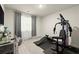 Bedroom featuring workout area, large window, and curtains at 2227 Foley Park St, Snellville, GA 30078