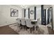 Elegant dining room with seating for six, stylish decor, and natural light at 2227 Foley Park St, Snellville, GA 30078