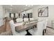 Open concept dining area with views of the kitchen and living room, perfect for entertaining at 2227 Foley Park St, Snellville, GA 30078