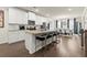 Spacious kitchen with white cabinetry, granite countertops, stainless steel appliances, and a large island with seating at 2227 Foley Park St, Snellville, GA 30078