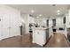Bright and airy kitchen with stainless steel appliances and an island with a sink at 2227 Foley Park St, Snellville, GA 30078