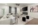 Sophisticated living room featuring a cozy sectional sofa, modern fireplace, and elegant decor at 2227 Foley Park St, Snellville, GA 30078