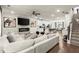 Inviting living space with a fireplace, sleek TV, and easy access to kitchen and dining area at 2227 Foley Park St, Snellville, GA 30078