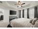 Comfortable bedroom with a TV, dresser, and ample natural light, connected to a laundry area at 2227 Foley Park St, Snellville, GA 30078