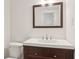 Bathroom features a wood vanity with white countertop, mirror, and sleek fixtures at 3282 Leslie Court Northeast Ne Ct, Atlanta, GA 30345