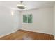Bedroom showcasing hardwood floors, a window with natural light, and a modern ceiling fan at 3282 Leslie Court Northeast Ne Ct, Atlanta, GA 30345