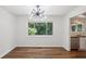 Bright dining area with modern light fixture, hardwood floors, and stainless steel appliances at 3282 Leslie Court Northeast Ne Ct, Atlanta, GA 30345