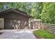 Home featuring a garage, a fenced yard, and a sunroom at 3282 Leslie Court Northeast Ne Ct, Atlanta, GA 30345