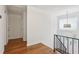 Hallway featuring hardwood floors, front door with glass sidelight, and decorative light fixture at 3282 Leslie Court Northeast Ne Ct, Atlanta, GA 30345