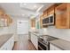 Bright kitchen boasts stainless appliances, subway tile backsplash, and ample counter space at 3282 Leslie Court Northeast Ne Ct, Atlanta, GA 30345