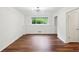 Bright living room features hardwood floors, a window, and access to other rooms at 3282 Leslie Court Northeast Ne Ct, Atlanta, GA 30345