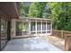 Sunroom with glass windows, a wooden deck, and a concrete patio at 3282 Leslie Court Northeast Ne Ct, Atlanta, GA 30345