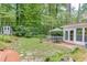 Inviting backyard with stone patio, shed, and seating area at 3219 Parkridge Crescent, Chamblee, GA 30341