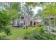Backyard with lush landscaping and multiple seating areas at 3219 Parkridge Crescent, Chamblee, GA 30341