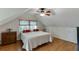 Cozy bedroom features hardwood floors and a ceiling fan at 3219 Parkridge Crescent, Chamblee, GA 30341