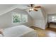 Hardwood floors and a ceiling fan highlight this cozy bedroom at 3219 Parkridge Crescent, Chamblee, GA 30341