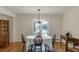 Traditional dining room with hardwood floors, white walls, chandelier, and French doors with natural light at 3219 Parkridge Crescent, Chamblee, GA 30341