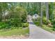 Beautiful view of the house with well-maintained front yard, gorgeous landscaping, and a long driveway at 3219 Parkridge Crescent, Chamblee, GA 30341