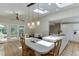Bright eat-in kitchen featuring an island, modern lighting and access to backyard at 3219 Parkridge Crescent, Chamblee, GA 30341