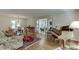 Elegant living room with hardwood floors, a piano, an adjacent room with a fireplace, and a dining area at 3219 Parkridge Crescent, Chamblee, GA 30341