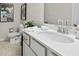 Stylish bathroom featuring modern fixtures, a white vanity, and decorative wall art at 402 Nix Ln, Lawrenceville, GA 30046