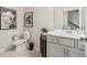 Well-lit bathroom with modern fixtures, a clean white vanity, and stylish artwork at 402 Nix Ln, Lawrenceville, GA 30046