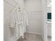 Bright walk-in closet with wire shelving and hanging rods with access to the bathroom at 402 Nix Ln, Lawrenceville, GA 30046