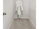 Walk-in closet with carpet and wire shelving, plus a robe hanging on the wall at 402 Nix Ln, Lawrenceville, GA 30046