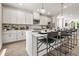 Contemporary kitchen with white cabinets, stainless steel appliances, an island, and pendant lighting at 402 Nix Ln, Lawrenceville, GA 30046