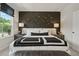 Stylish bedroom features an accent wall, king bed, bedside tables and lamps providing a tranquil retreat at 402 Nix Ln, Lawrenceville, GA 30046