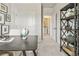 Bright office space with a dark table, globe, neutral decor, and a glimpse into the nearby laundry room at 402 Nix Ln, Lawrenceville, GA 30046