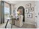 Bright office space with a modern desk, neutral chairs, and large picture window at 402 Nix Ln, Lawrenceville, GA 30046