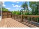 Wooden deck with fencing overlooking a scenic view of trees at 775 Hadley Ne Ln, Marietta, GA 30068