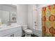Bathroom with white vanity, patterned shower curtain, and tub/shower combination at 775 Hadley Ne Ln, Marietta, GA 30068