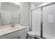 Bathroom featuring a single sink vanity, a toilet, and glass enclosed tiled shower at 775 Hadley Ne Ln, Marietta, GA 30068